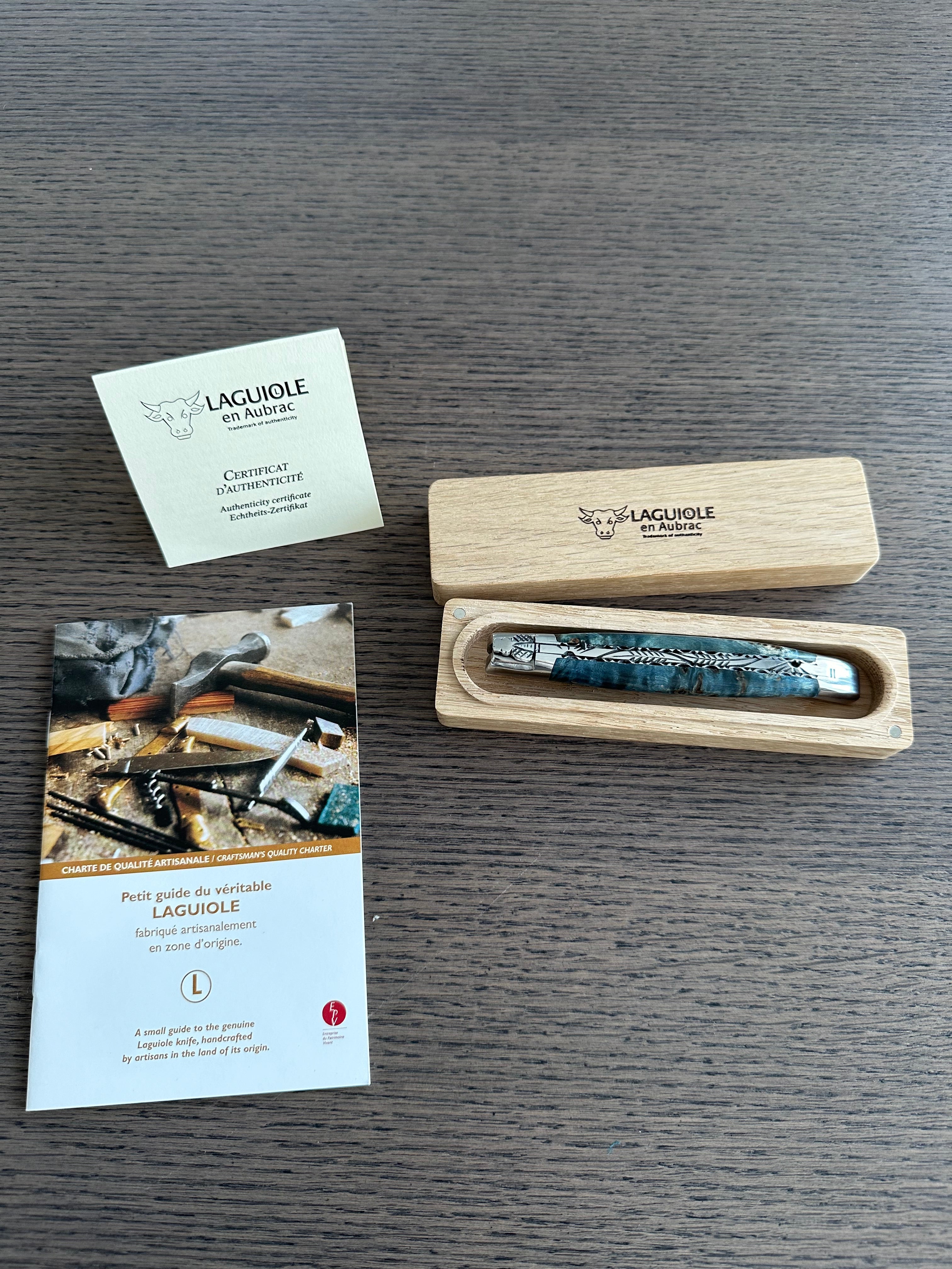 Laguiole en Aubrac Handcarved Plates Multipurpose Knife with Stabilized Blue Poplar Burl Handle, Polished Bolsters, 4.75-Inches